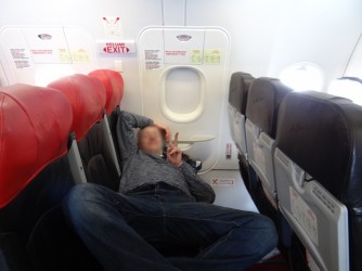 09 Sleep on AirAsia board